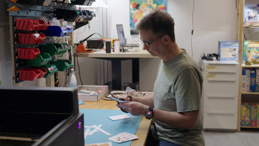 Homo Ludens – Still 02 Game designer Arno Steinwender working on a game prototype